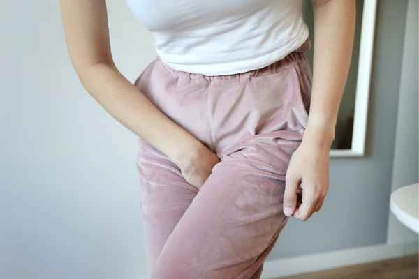 woman running for the toilet because of urinary incontinence Holme Chapel